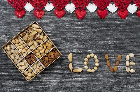 Valentine's day concept. Assorted box of nuts Stock Photos
