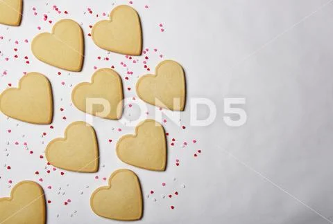 Valentines Day Concept: Fresh Baked Heart Shaped Cookies With Candy Heart Spr