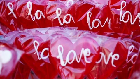Valentine's Day Concept: a lot of red candy in shape of the heart Stock Footage 85299456