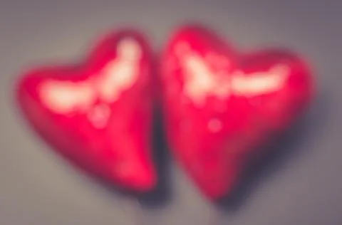 Valentine's day concept, two red blurred hearts Stock Photos