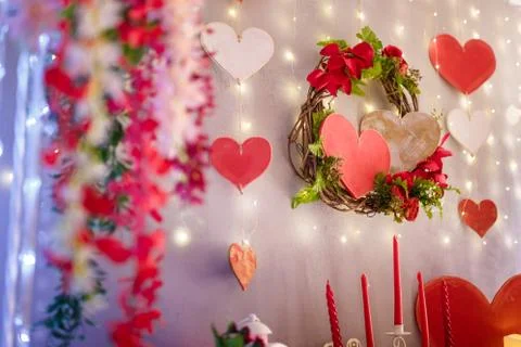 Valentine`s day decorative elements, festive romantic wreath and wooden hearts Stock Photos