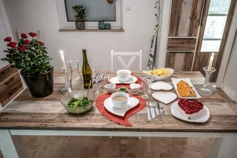 Valentines day dinner setting romantic love for two wooden table red heart sh Stock Photos