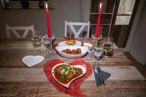 Valentines day dinner setting romantic love for two wooden table red heart sh Stock Photos