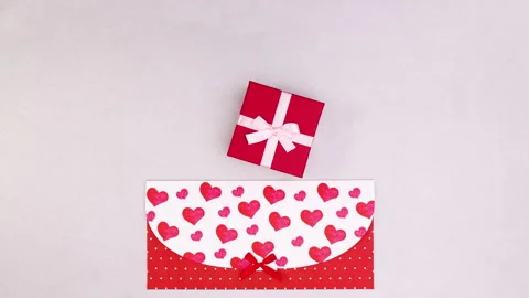 Valentine's day envelope, gift and hearts appear. Stop motion Stock Footage 146566497