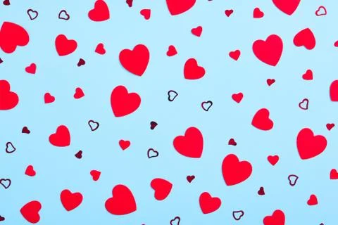 Valentines Day festive pattern. Red hearts on baby blue background Stock Photos