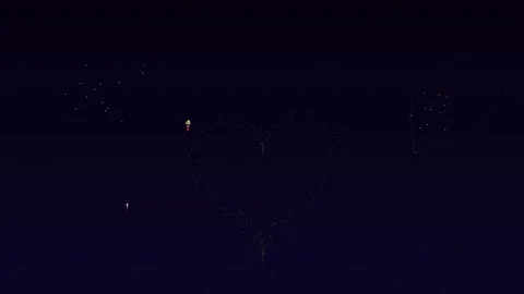 Valentines day firework display with hearts in night sky at celebration event Stock Footage 327429124