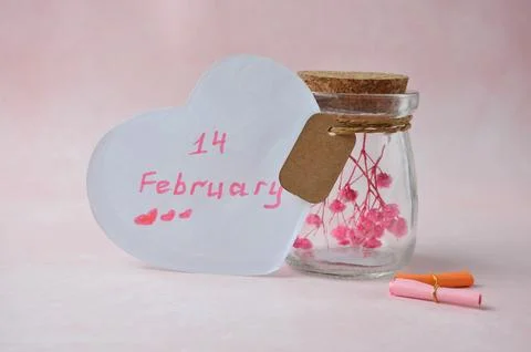 Valentine's Day. A flocon with pink flowers on a pink background. Stock Photos