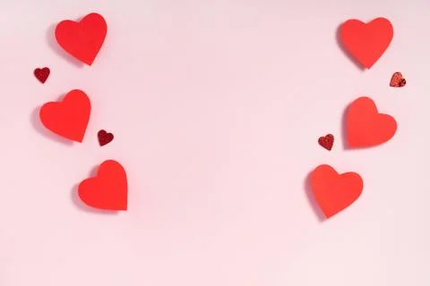 Valentine's day frame composition. Red hearts on pastel pink background. Top Stock Photos