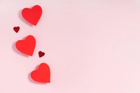 Valentine's day frame composition. Red hearts on pastel pink background. Top Foto stock