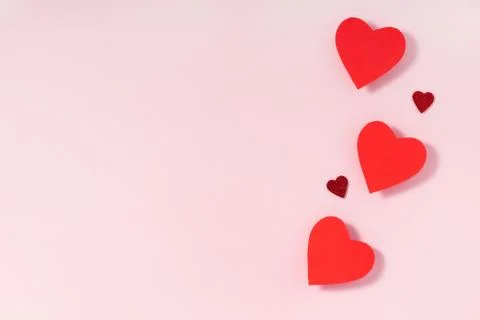 Valentine's day frame composition. Red hearts on pastel pink background. Top Stock Photos