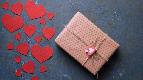 Valentine's Day gift presented by unrecognizable men, concept of romantic love Stock Photos