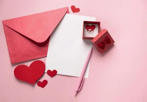 Valentine's Day gift. Ring, proposal of marriage, flat lay Stock Photos