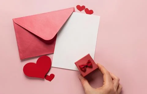 Valentine's Day gift. Ring, proposal of marriage, flat lay Stock Photos
