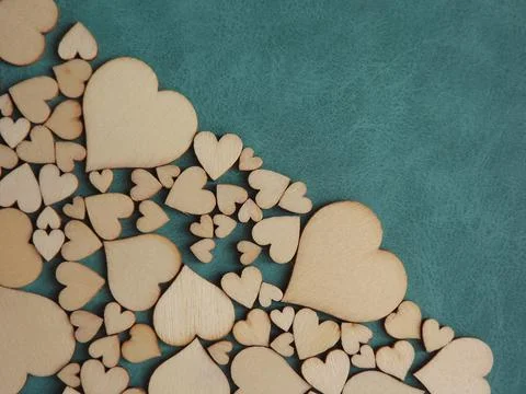 Valentine's day greeting card-wooden hearts on a gray suede background Stock Photos