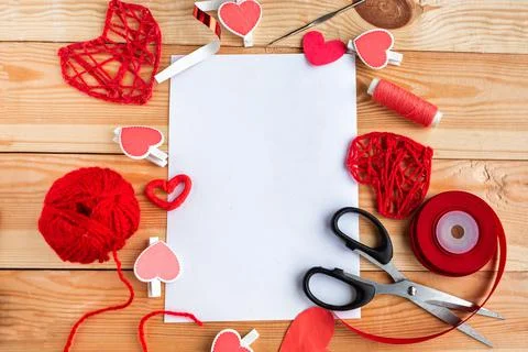 Valentine's Day Handmade Red Thread Hearts, needlework supplies and white moc Stock Photos
