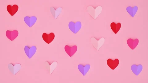 Valentine's day hearts making pattern on pastel pink background. Stop motion Stock-Footage 229744360