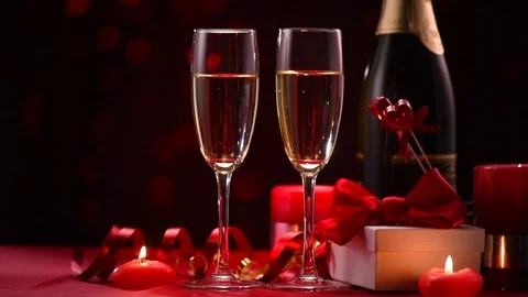 Valentine's Day romantic dinner. Date. Champagne, candles and gift box Video stock 84139806