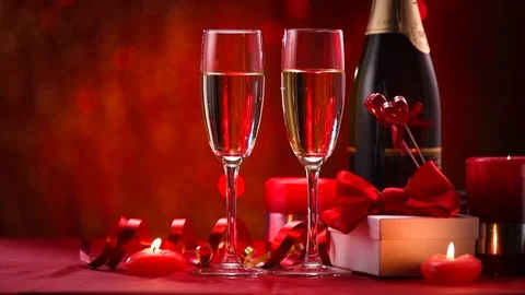 Valentine's Day romantic dinner. Date. Champagne, candles and gift box Stock Footage 84139864