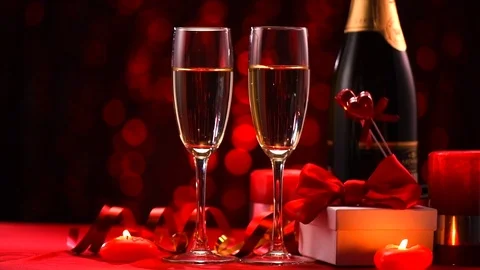 Valentine's Day romantic dinner. Date. Champagne, candles and gift box Stock Footage 101912184