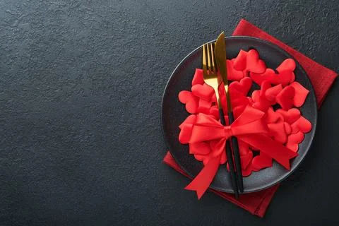 Valentines day romantic table setting. Empty or closeup of a dinner black pla Stock Photos