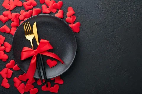 Valentines day romantic table setting. Empty or closeup of a dinner black pla Stock Photos