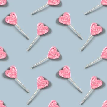 Valentines day seamless pattern of heart shaped pink lollypops. Stock Photos