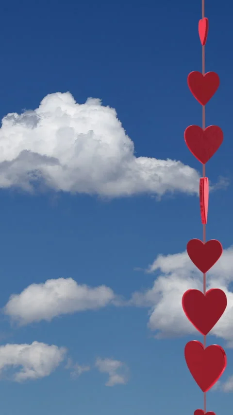 Valentines Day String of Hearts with Blue Sky Background Vertical 库存影片 261987359