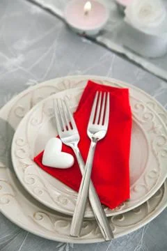 Valentines day table. Plate with two forks and hearts. Valentine's day dinner Stock Photos