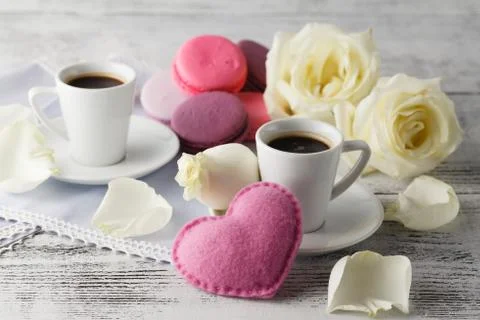 Valentines day table setting with cups, red hearts, ribbon and roses. Valen.. Stock Photos