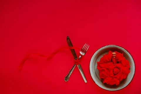 Valentine's day table setting on red background with copy space Stock Photos