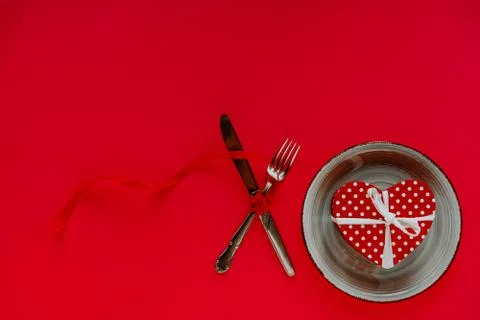 Valentine's day table setting on red background with copy space Stock Photos