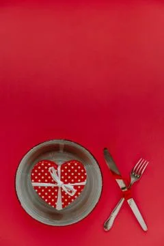 Valentine's day table setting on red background with copy space Stock Photos