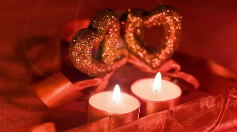 Valentines day, two candles burning in front of two hearts Stock Footage 45658261