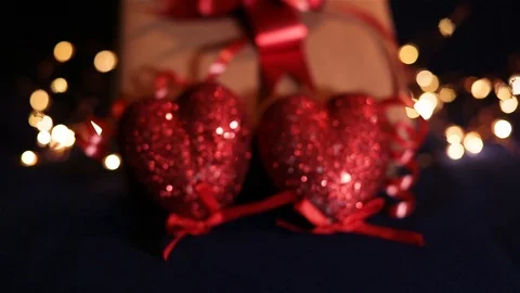 By Valentine's day. Two hearts on the background of the gift box Stock Footage 100742243
