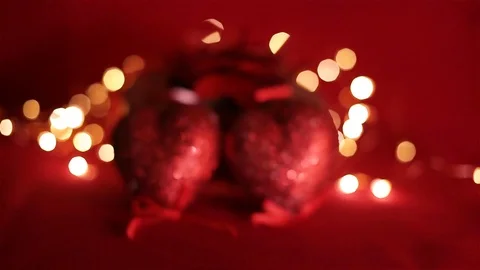 By Valentine's day. Two hearts on a red background Stock Footage 100742247