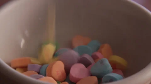 Valentine's Heart Candy Falling into Bowl Video stock 34282445