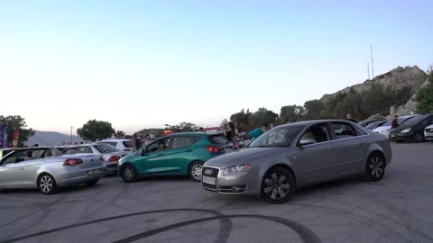 Valet helping driver park in Drive In cinema Stock Footage 142942506