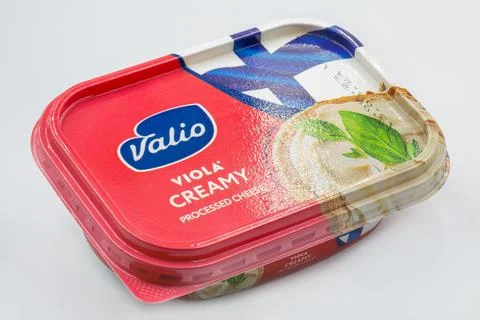 Valio Viola Creamy processed cheese container closeup on white. Stock Photos