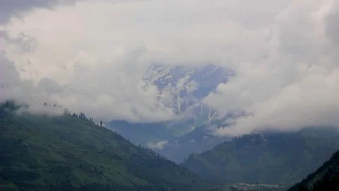 Vallage in the mountain valley with heavy cloud Stock Footage 94559406