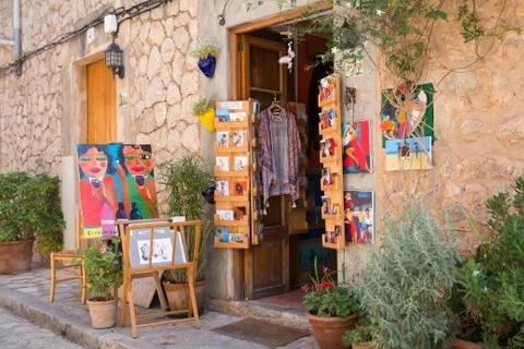 VALLDEMOSSA, SPAIN - JUNE 2016 display of paint art in small souvenir shop on Stock Photos