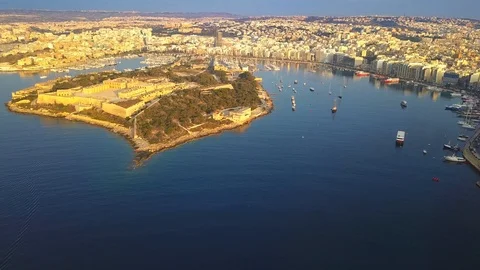 Valleta - 4K flying over Manoel Island with Sliema, Gzira and Ta'Xbiex, Malta Stock Footage 91785731