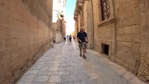 Valleta, Malta - 06/01/2024: Quickly navigating the cozy and narrow Stock Footage 278856928