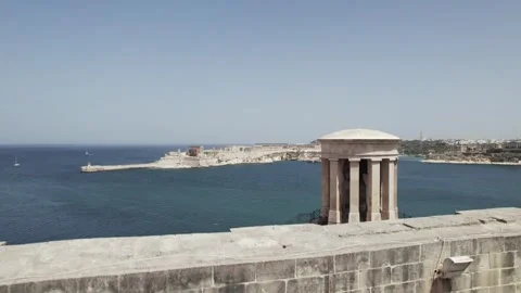 Valletta, Malta Aerial pull up to view Fort Ricasoli Stock Footage 248011501