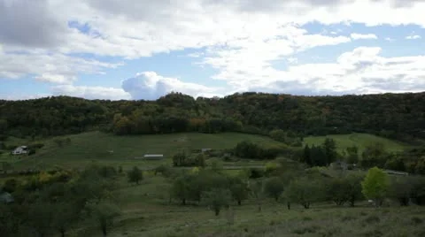 Valley and hillside in Fall - slow tilt upward Stock Footage 22322108