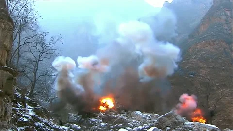 A valley carpet-bombed Stock Footage 316815241
