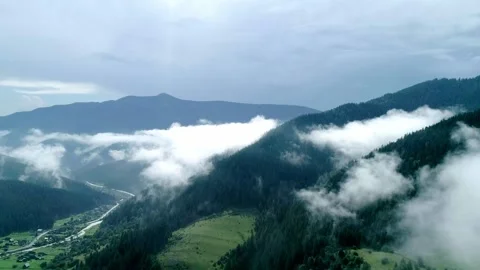 Valley with clouds and mist covers wood, valley Stock Footage 325661532