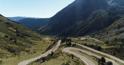 Valley with complex road travelling through the terrain drone aerial 4k Stock Footage 125756994
