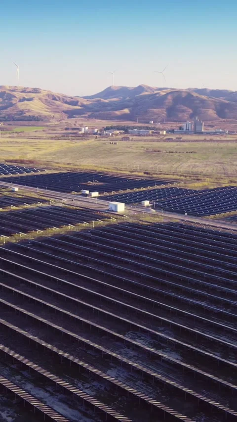 Valley with cultivated fields and solar panels, vertical short video Stock Footage 283344891