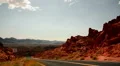 Valley of Fire 12 Road in Nevada desert Cars passing by CIRCA HD Footage