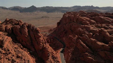 Valley of Fire Scenic Drive Between Red Rock Cliffs Drone Stock Footage 317435141